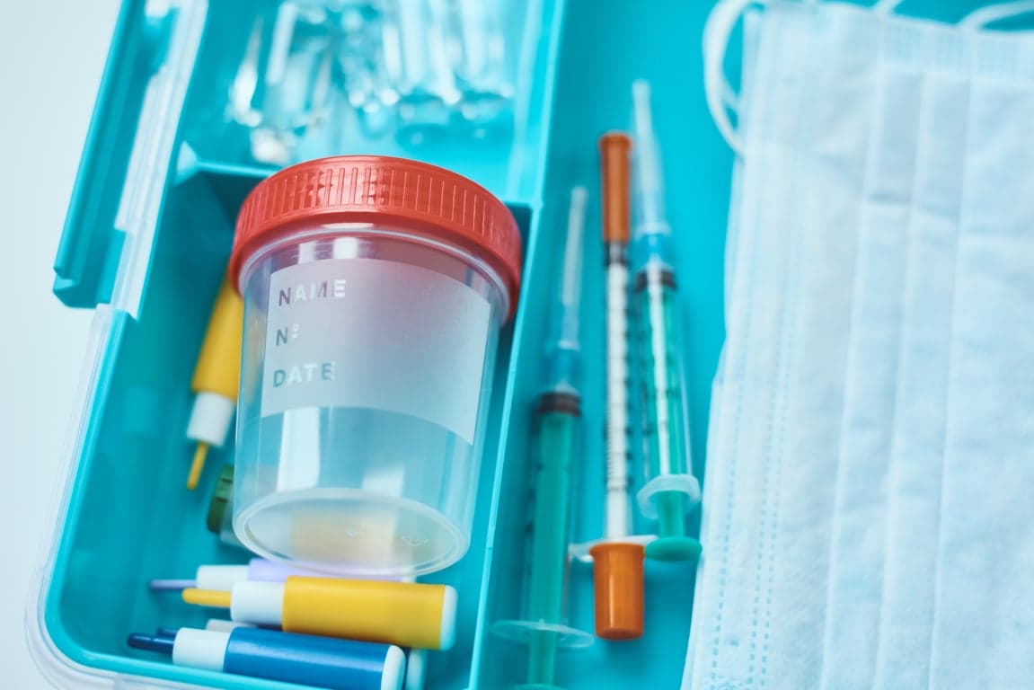 Stool sample collection kit and lab request form for a fecal occult blood test